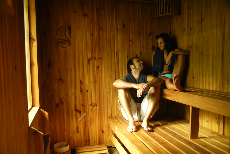 a person sitting on top of a wooden door